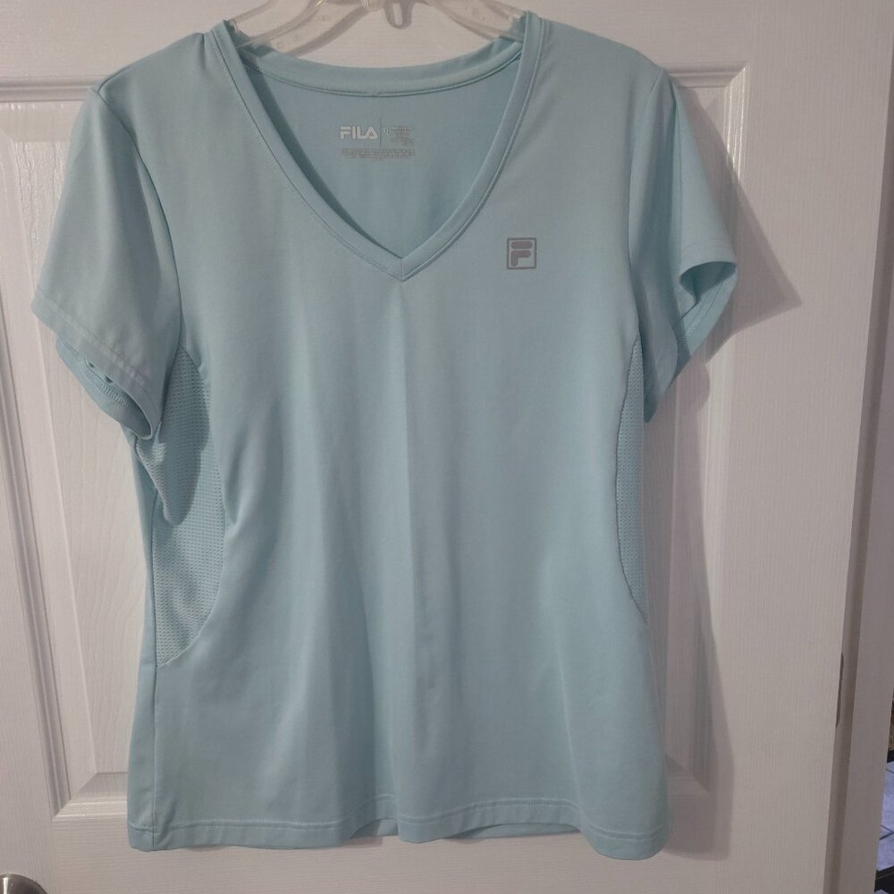 Nice preowned Fila V-neck top. SIze XL. Color: Baby Blue